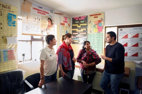 Fernando and his colleagues with a local healthcare worker at a healthcare center in Bolivia