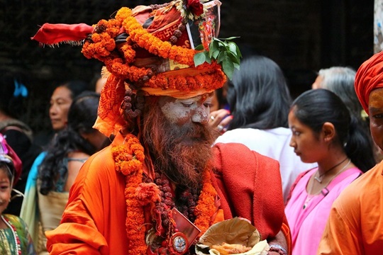 Picture of Nepalese man painted with traditional religious colours